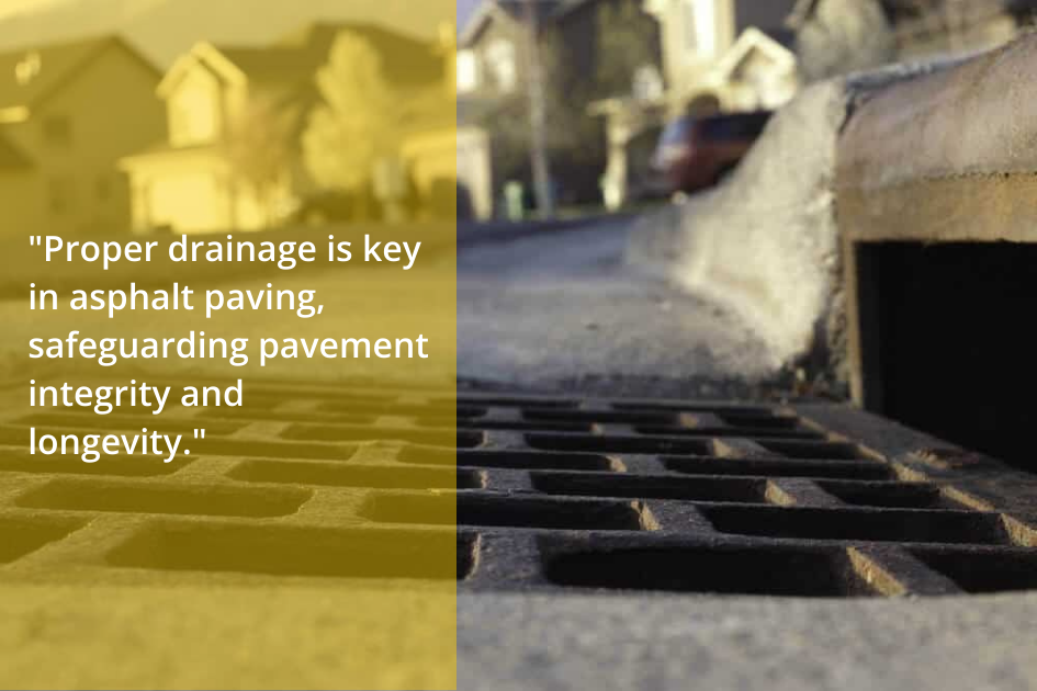 Street drainage grate alongside an asphalt paved road, illustrating the importance of water management in urban infrastructure.